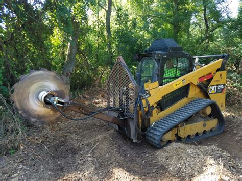 using a skid steer to clear land|john deere land clearing equipment.